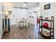 Charming dining area features a round table, chairs, and a sliding barn door to the kitchen at 582 Ridgewood Nw St, Port Charlotte, FL 33952
