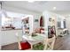 Open-concept dining and kitchen area features a seamless transition with light-filled spaces at 582 Ridgewood Nw St, Port Charlotte, FL 33952