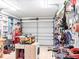 Spacious garage equipped with workbench, tools, and organized storage solutions at 582 Ridgewood Nw St, Port Charlotte, FL 33952