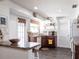 The kitchen area features a center island, a dishwasher, wood cabinets, and lots of natural light at 582 Ridgewood Nw St, Port Charlotte, FL 33952