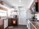 Cozy kitchen features wood cabinets, tile backsplash, and modern appliances for easy meal preparation at 582 Ridgewood Nw St, Port Charlotte, FL 33952