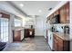 Bright kitchen showcasing ample cabinet space, modern appliances, and a view into the dining area at 582 Ridgewood Nw St, Port Charlotte, FL 33952