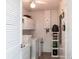 Functional laundry room with ample storage cabinets and modern washer/dryer units at 582 Ridgewood Nw St, Port Charlotte, FL 33952