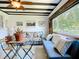 Bright living room with comfortable seating, beautiful natural light, and charming backyard views at 582 Ridgewood Nw St, Port Charlotte, FL 33952