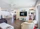 Open concept living area with sleek floors, white walls, and a dining space is perfect for entertaining at 582 Ridgewood Nw St, Port Charlotte, FL 33952
