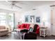 Comfortable living room with a red sofa, recliner, and bright, natural light at 582 Ridgewood Nw St, Port Charlotte, FL 33952