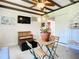 Charming living space features a ceiling fan, comfortable seating, and plenty of natural light at 582 Ridgewood Nw St, Port Charlotte, FL 33952