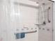 Accessible shower with safety features including grab bars and adjustable shower head at 582 Ridgewood Nw St, Port Charlotte, FL 33952