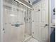 Tiled shower area with clear shower curtains and safety bar for accessibility and comfort at 582 Ridgewood Nw St, Port Charlotte, FL 33952