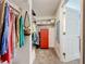Organized walk-in closet with ample storage and a glimpse into an adjacent room at 582 Ridgewood Nw St, Port Charlotte, FL 33952