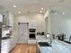 Spacious kitchen with modern oven and hardware with view to dining room at 6308 Grove Blvd, Punta Gorda, FL 33982