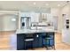 Kitchen with gray counters, island with black base, stainless appliances at 6308 Grove Blvd, Punta Gorda, FL 33982