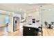 Bright, white kitchen featuring stainless steel appliances, an island, and modern finishes at 6308 Grove Blvd, Punta Gorda, FL 33982
