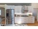 A closer view of the modern, stainless steel appliances in the well-lit kitchen at 6308 Grove Blvd, Punta Gorda, FL 33982