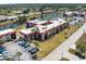 Aerial view of condominium complex, parking area, and a canal running behind the buildings at 72 Boundary Blvd # 226, Rotonda West, FL 33947