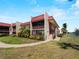 Charming condo building with lush landscaping, private balconies, and a beautiful waterside location at 72 Boundary Blvd # 226, Rotonda West, FL 33947