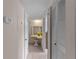 Hallway with a built-in vanity area and closed louvered closet doors with an electrical panel at 72 Boundary Blvd # 226, Rotonda West, FL 33947