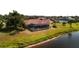 Screened in lanai and tile roof over backyard overlooking water at 730 Boundary Blvd, Rotonda West, FL 33947