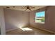 Bright bedroom with tile flooring and a large window offering serene pond views at 730 Boundary Blvd, Rotonda West, FL 33947