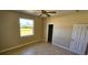 Bedroom with tile flooring, a standard closet, and a large window, ideal for personalization at 730 Boundary Blvd, Rotonda West, FL 33947