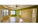 Bright bedroom with tile flooring and large windows overlooking the backyard pool area at 730 Boundary Blvd, Rotonda West, FL 33947