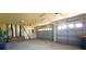 Three car garage with shelving and a ladder at 730 Boundary Blvd, Rotonda West, FL 33947