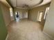 Expansive living room with tile flooring and multiple entryways, offering ample space and natural light at 730 Boundary Blvd, Rotonda West, FL 33947
