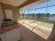 Enclosed patio with outdoor kitchen area and views of the canal at 730 Boundary Blvd, Rotonda West, FL 33947
