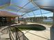 Enclosed pool area overlooking the canal at 730 Boundary Blvd, Rotonda West, FL 33947