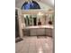 Open bathroom featuring a large countertop, dual sinks, and large mirrors at 2575 Brazilia Ct, Punta Gorda, FL 33950