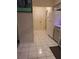 Bright kitchen with white cabinets, white appliances, and contrasting flooring tile with geometric decorative design at 2575 Brazilia Ct, Punta Gorda, FL 33950