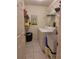 Tidy laundry room with shelves, storage bin, and white washing machine at 2575 Brazilia Ct, Punta Gorda, FL 33950