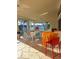 Screened porch with colorful furniture overlooking a waterway view at 2575 Brazilia Ct, Punta Gorda, FL 33950