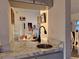 Modern Wet Bar features grey cabinetry, marble countertop, stainless sink fixtures and views into the Living and Dining Rooms at 2575 Brazilia Ct, Punta Gorda, FL 33950