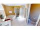 Bathroom with large soaking tub, glass enclosed shower, and tile flooring at 10203 Windsong Rd, Punta Gorda, FL 33955