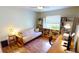 Bedroom with a futon, bookshelves, and a desk, creating a versatile space at 10203 Windsong Rd, Punta Gorda, FL 33955