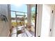 Bright foyer with tiled floor, screened doorway, and white walls at 10203 Windsong Rd, Punta Gorda, FL 33955