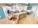 Bright, open kitchen with stainless steel appliances and a large center island at 10203 Windsong Rd, Punta Gorda, FL 33955
