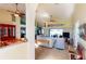 Spacious living room featuring tile floors, fan, and sliding doors leading to the pool at 10203 Windsong Rd, Punta Gorda, FL 33955