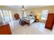 Spacious main bedroom retreat with pool access, a ceiling fan, and plenty of natural light at 10203 Windsong Rd, Punta Gorda, FL 33955