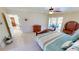Comfortable main bedroom with an ensuite bathroom and convenient access to the pool area at 10203 Windsong Rd, Punta Gorda, FL 33955