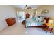 Lovely main bedroom with neutral tones, a ceiling fan, and a private entrance to the patio at 10203 Windsong Rd, Punta Gorda, FL 33955