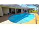 Beautiful backyard pool with a screened lanai, perfect for outdoor entertaining at 10203 Windsong Rd, Punta Gorda, FL 33955