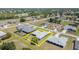 Aerial view of the property, showcasing its location within a neighborhood with mature trees at 1069 Fergus Ln, Punta Gorda, FL 33983
