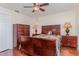 Cozy bedroom featuring a wooden bed frame, hardwood floors, and matching dressers at 1069 Fergus Ln, Punta Gorda, FL 33983