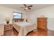 Comfortable bedroom with a window view, hardwood floors, and a classic dresser at 1069 Fergus Ln, Punta Gorda, FL 33983