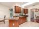 Kitchen featuring granite countertops, wood cabinets, and a breakfast bar area at 1069 Fergus Ln, Punta Gorda, FL 33983