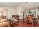 Open-concept living room and dining area with hardwood floors and plenty of natural light at 1069 Fergus Ln, Punta Gorda, FL 33983