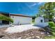 This backyard features a shed, grassy area, and outdoor patio at 12420 Minot Ave, Port Charlotte, FL 33981