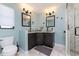 Stylish bathroom featuring dual vessel sinks, modern fixtures, and a walk-in shower with marble tile at 12420 Minot Ave, Port Charlotte, FL 33981